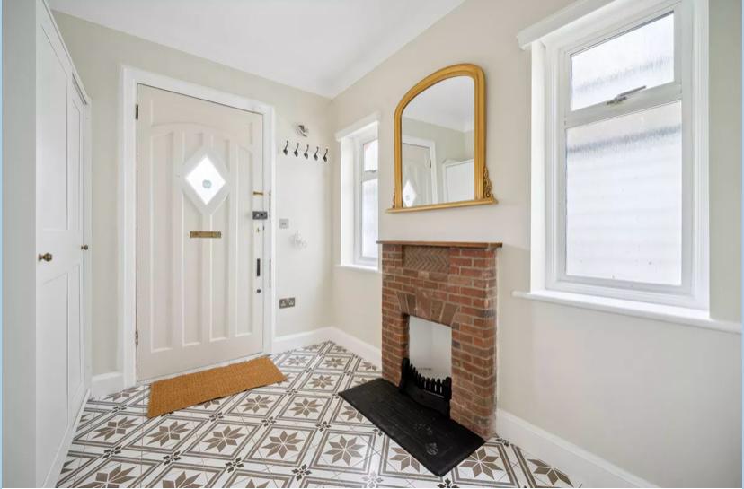 Finished entrance hall and fireplace, residential renovation in London