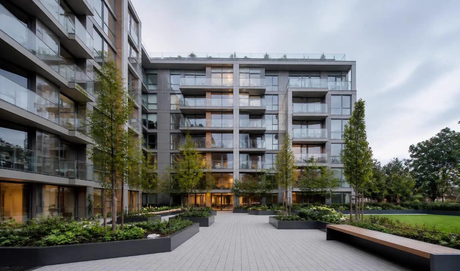 Modern Build-to-Rent residential building in London with landscaped courtyard, representing institutional BTR maintenance and asset management.