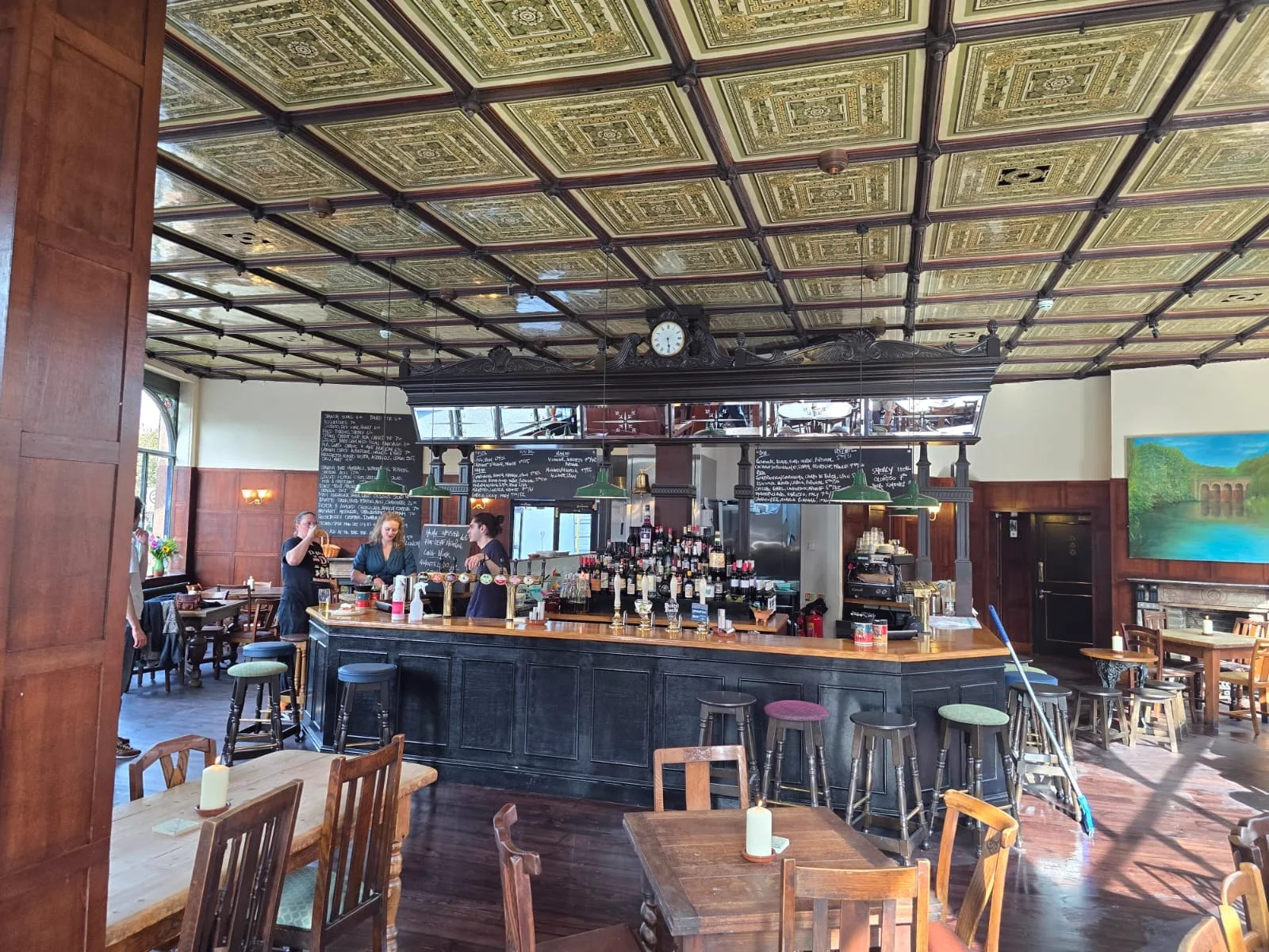 The Fleet Tavern open for business with customers, wooden tables and the finished bar