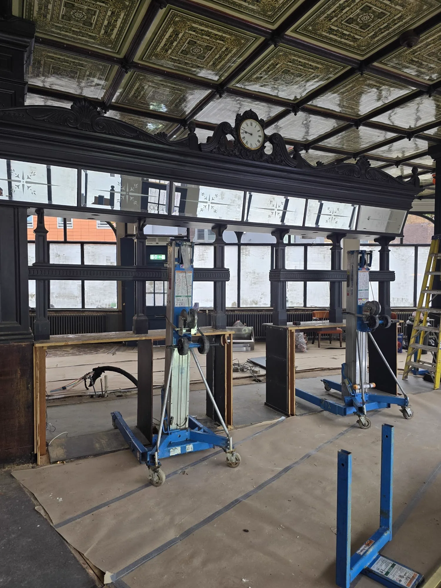 Close view of the ornate Victorian clock gantry supported on lifting jacks